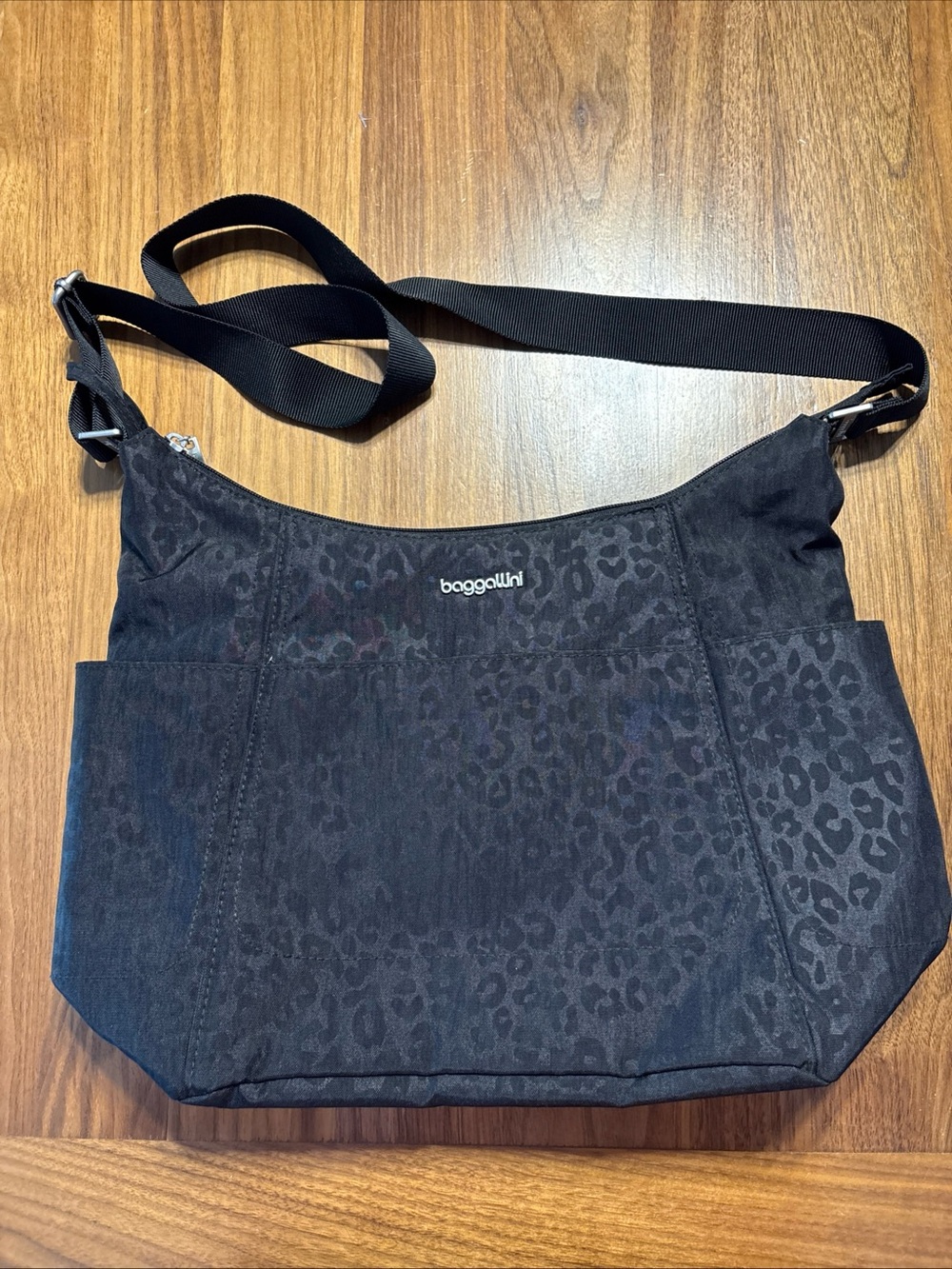 Baggallini Black Leopard-Print Crossbody Bag 14”x10” with detachable pouch.
